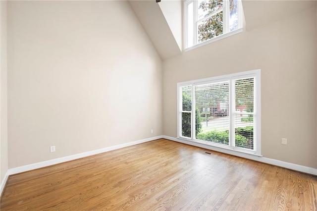 4957 Day Lily Way NW, Acworth, GA 30102 - unfurnished room featuring high vaulted ceiling, wood finished floors, and baseboards