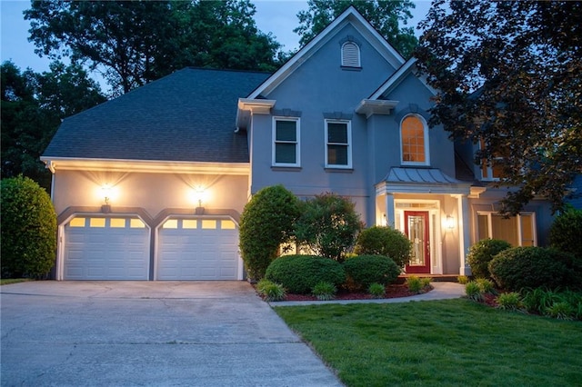 4957 Day Lily Way NW, Acworth, GA 30102 - view of front facade featuring concrete driveway, an attached garage, stucco siding, a shingled roof, and a front lawn