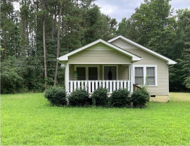 bungalow-style home with crawl space, covered porch, and a front lawn