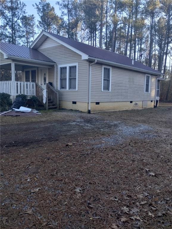 view of property exterior with crawl space
