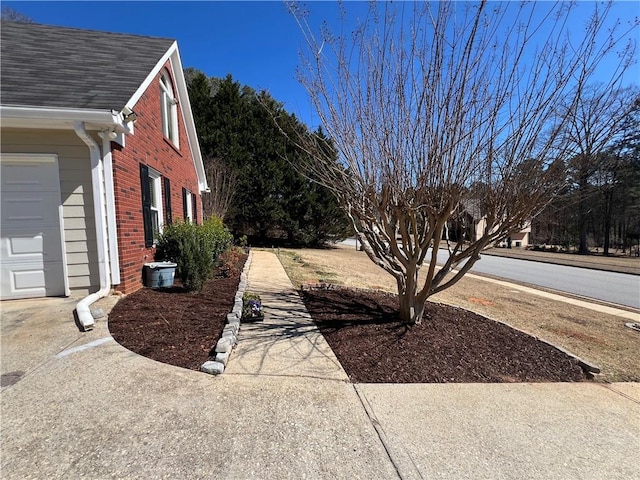 view of yard featuring an attached garage