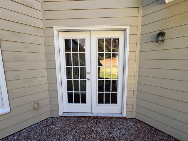 view of exterior entry featuring french doors