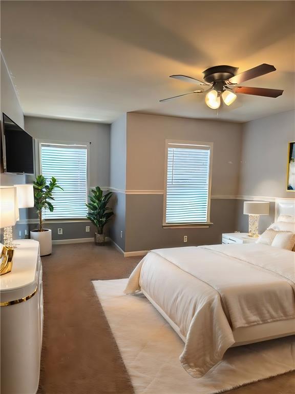 carpeted bedroom featuring ceiling fan