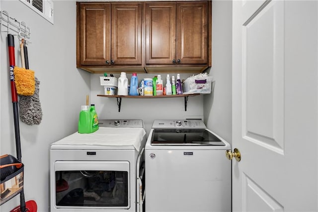 laundry area featuring cabinet space and independent washer and dryer