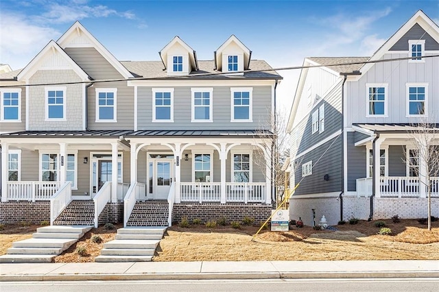 townhome / multi-family property with covered porch