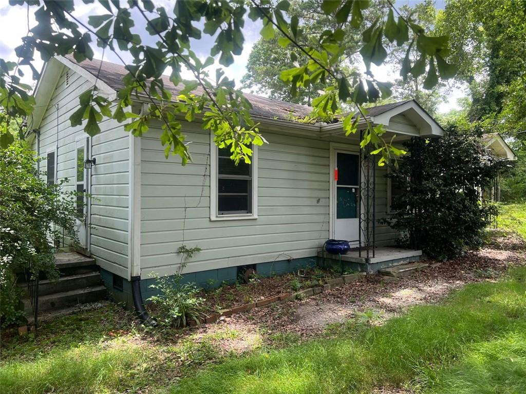 2096 Boar Tusk Rd NE, Conyers, GA 30012 - view of side of property featuring crawl space