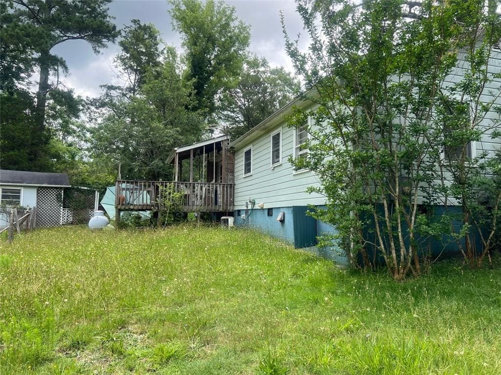 2096 Boar Tusk Rd NE, Conyers, GA 30012 - view of yard with a deck
