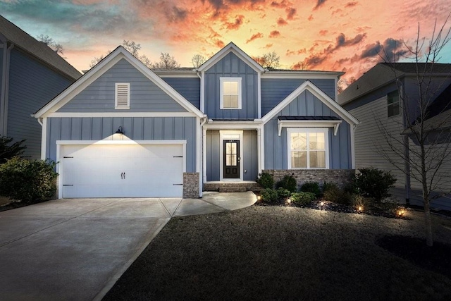 view of front of home featuring a garage, driveway, and board and batten siding