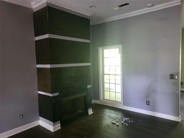 164 Mcclain Cir, Macon, GA 31216 - unfurnished living room featuring crown molding and wood finished floors