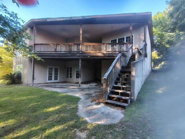 164 Mcclain Cir, Macon, GA 31216 - back of house featuring french doors, stairway, a lawn, and a wooden deck
