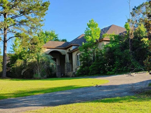 164 Mcclain Cir, Macon, GA 31216 - view of front of property featuring stucco siding and a front lawn