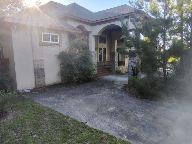 164 Mcclain Cir, Macon, GA 31216 - property entrance with stone siding and stucco siding