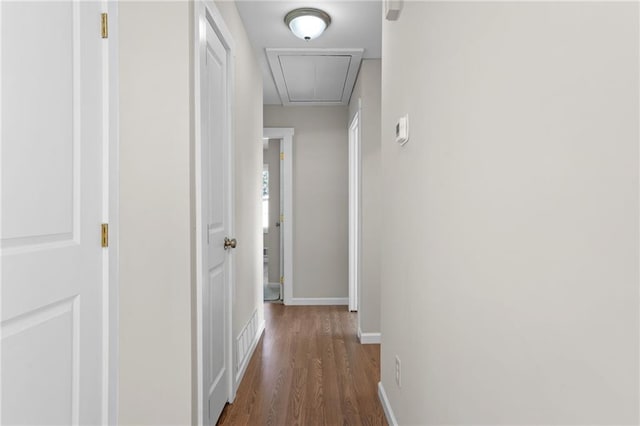 hall with dark hardwood / wood-style flooring