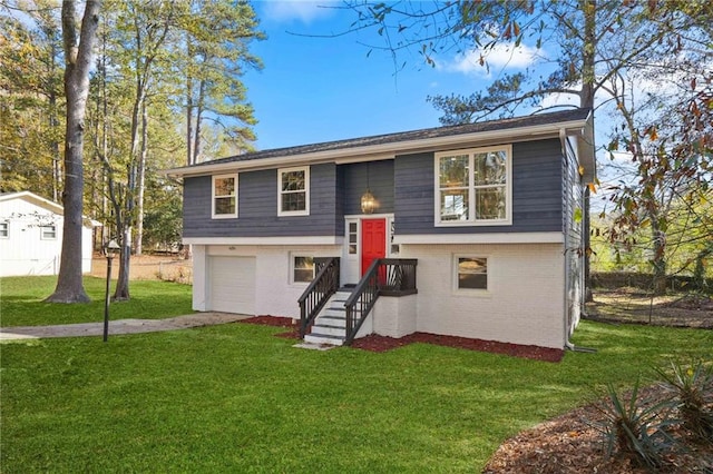 bi-level home featuring a front lawn and a garage