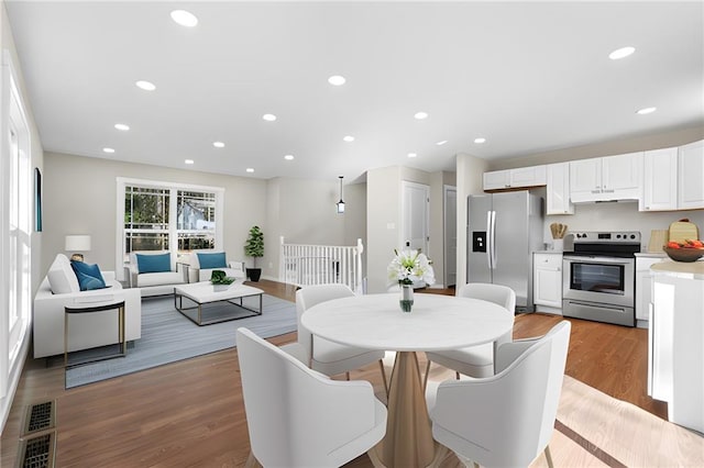 dining room with light wood-type flooring