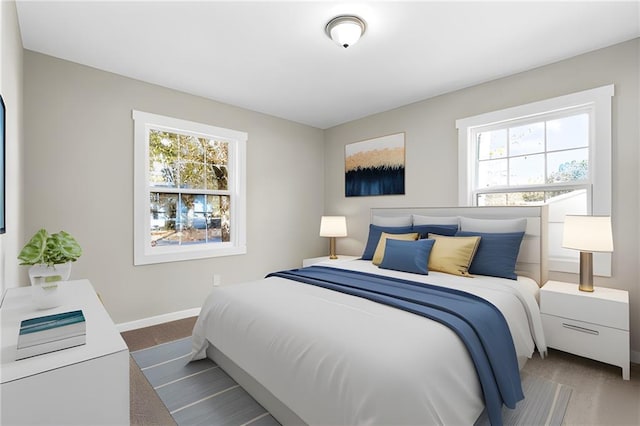 carpeted bedroom featuring multiple windows