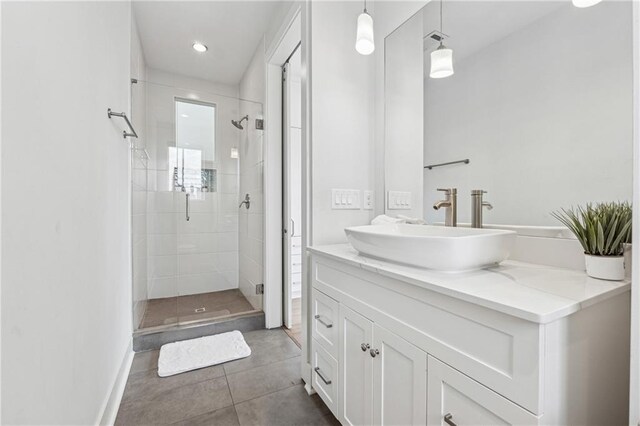 bathroom featuring vanity, tile patterned floors, and toilet