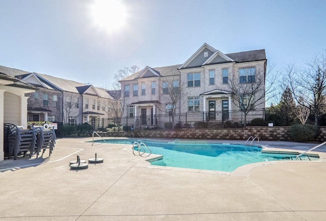 view of pool featuring a patio area