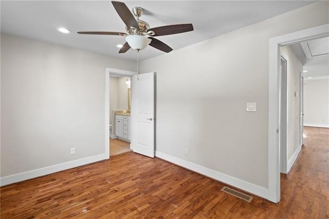 2677 Tilson Rd, Decatur, GA 30032 - unfurnished bedroom with baseboards, wood finished floors, recessed lighting, attic access, and ceiling fan