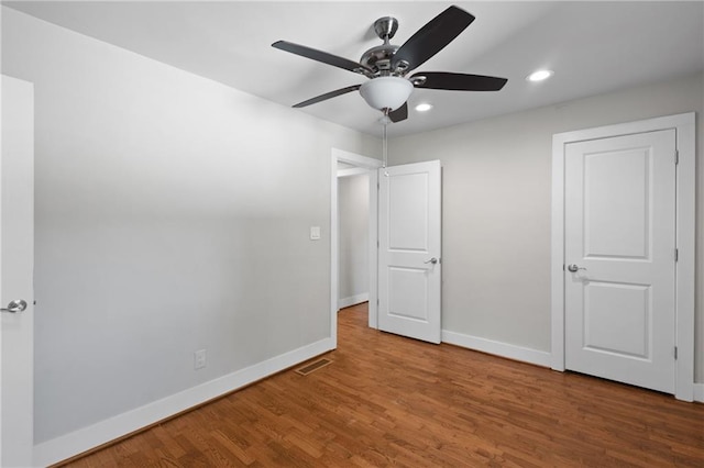 2677 Tilson Rd, Decatur, GA 30032 - unfurnished bedroom featuring recessed lighting, baseboards, wood finished floors, and a ceiling fan