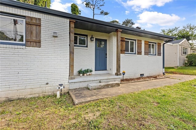 2677 Tilson Rd, Decatur, GA 30032 - property entrance with brick siding, a yard, and crawl space