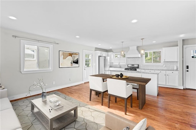 2677 Tilson Rd, Decatur, GA 30032 - living area with light wood-type flooring, recessed lighting, and baseboards