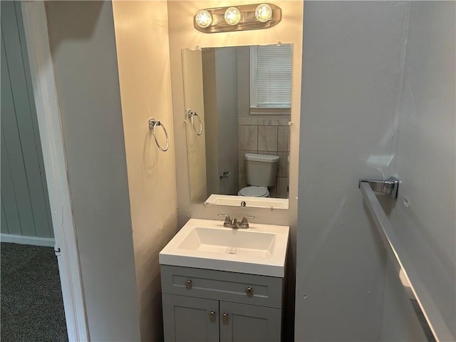 bathroom with vanity and toilet