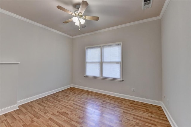 empty room featuring ornamental molding, light wood-type flooring, and ceiling fan