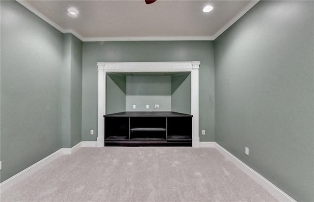 unfurnished room featuring ornamental molding and carpet floors