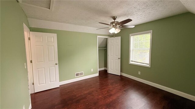 446 Russell Cemetery Rd, Winder, GA 30680 - unfurnished bedroom with a textured ceiling, wood finished floors, baseboards, a closet, and a ceiling fan