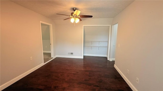 446 Russell Cemetery Rd, Winder, GA 30680 - unfurnished room featuring a ceiling fan, dark wood-style flooring, baseboards, and a textured ceiling