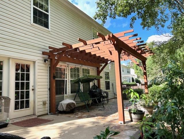 view of patio featuring a pergola