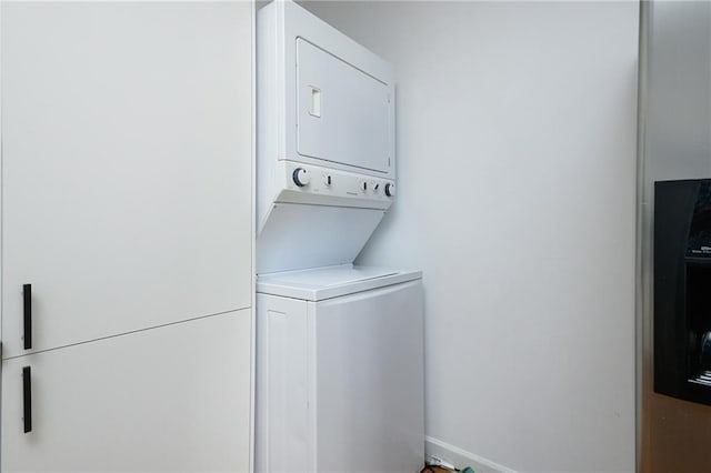 laundry room featuring stacked washing maching and dryer