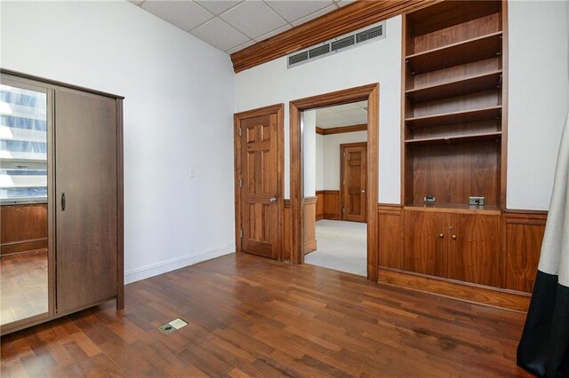 unfurnished bedroom featuring dark wood-type flooring