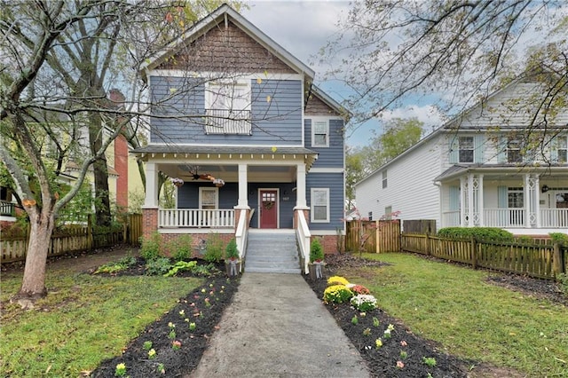 view of front facade featuring a front yard and a porch