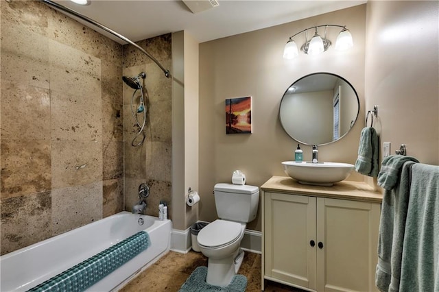 full bathroom with vanity, toilet, and tiled shower / bath combo