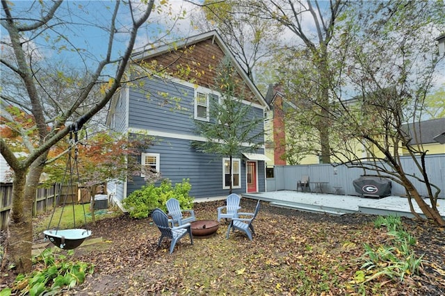 exterior space with a patio area and an outdoor fire pit