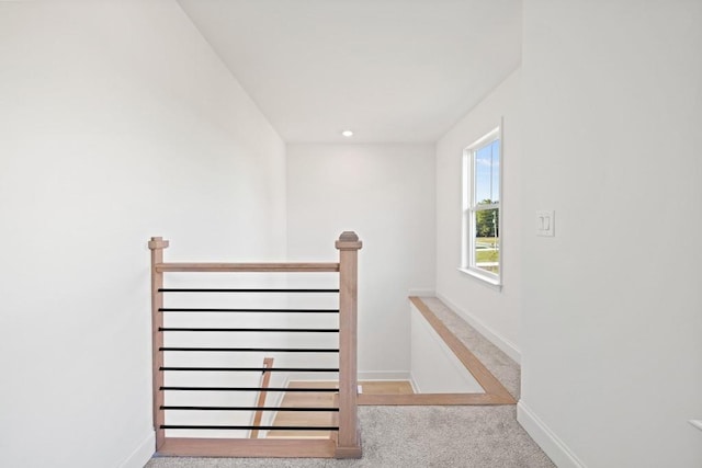 stairs with carpet and baseboards