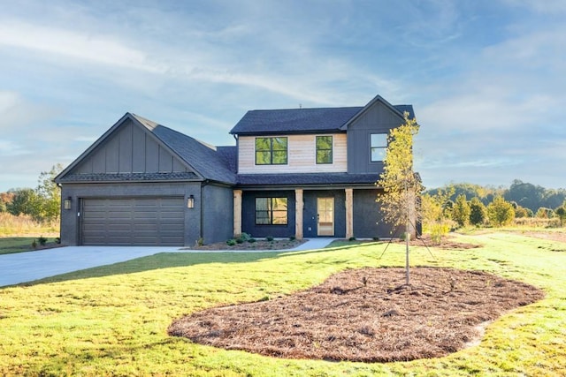 modern farmhouse style home with a garage, a front yard, board and batten siding, and concrete driveway