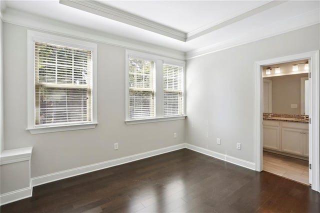 interior space featuring crown molding, dark wood-style floors, and baseboards