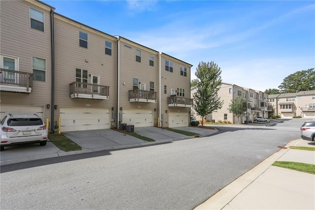 view of street featuring sidewalks, a residential view, and curbs