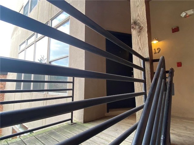 staircase featuring hardwood / wood-style flooring