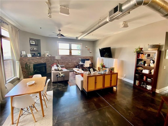 living room with brick wall, a fireplace, and ceiling fan