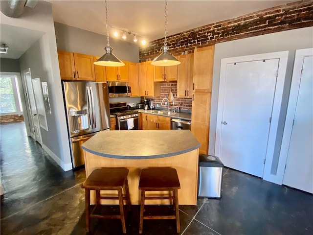 kitchen featuring decorative backsplash, appliances with stainless steel finishes, light brown cabinetry, pendant lighting, and brick wall