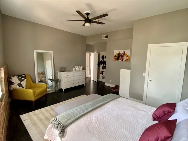 bedroom with ceiling fan and dark hardwood / wood-style floors