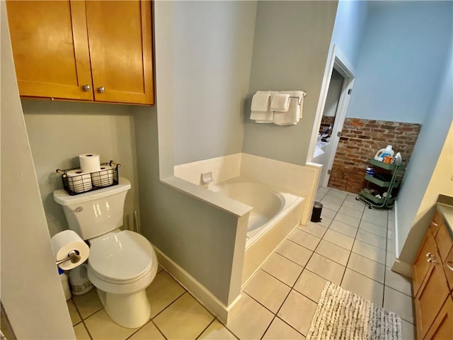 bathroom featuring toilet, a tub to relax in, vanity, and tile patterned flooring