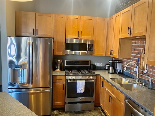 kitchen featuring decorative backsplash, stainless steel appliances, and sink