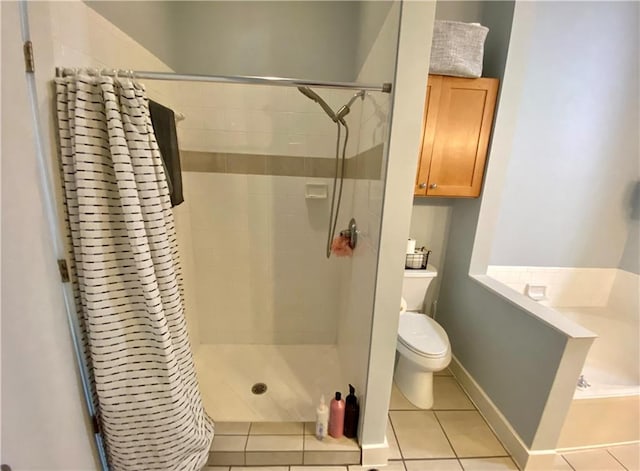 bathroom featuring toilet, tile patterned flooring, and a shower with shower curtain