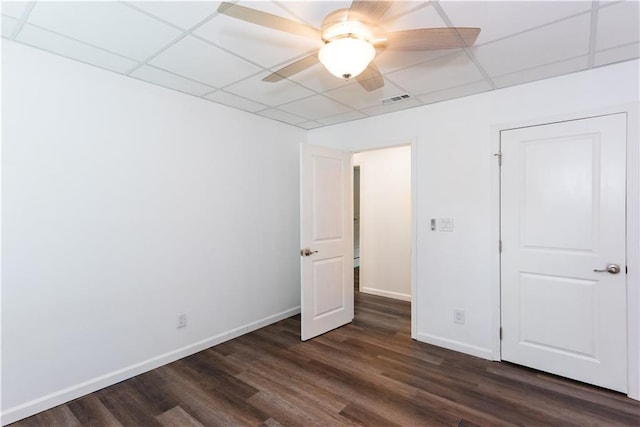 3336 Forrest Hills Dr, Hapeville, GA 30354 - unfurnished bedroom with dark wood-style floors, a drop ceiling, and ceiling fan
