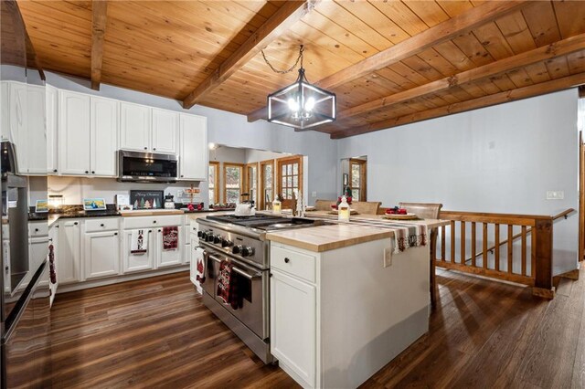 kitchen with pendant lighting, appliances with stainless steel finishes, dark hardwood / wood-style flooring, white cabinetry, and wood ceiling